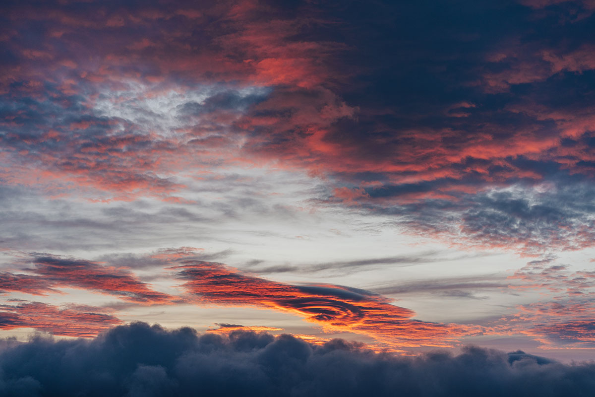 lemticular dramatic sunset or sunrise clouds in the sky