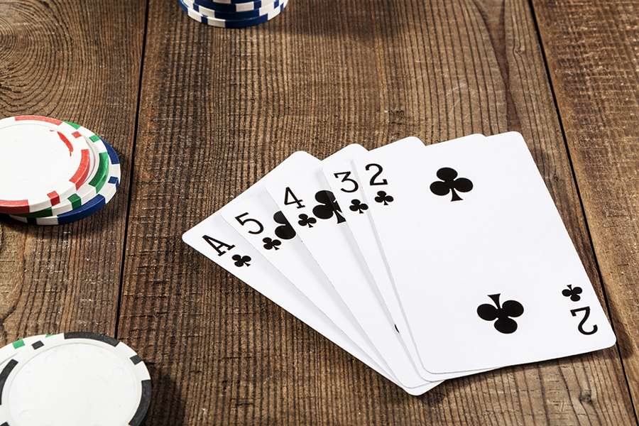 Black game cards on brown wood table